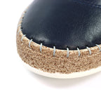 Evie Navy Leather Plimsoll